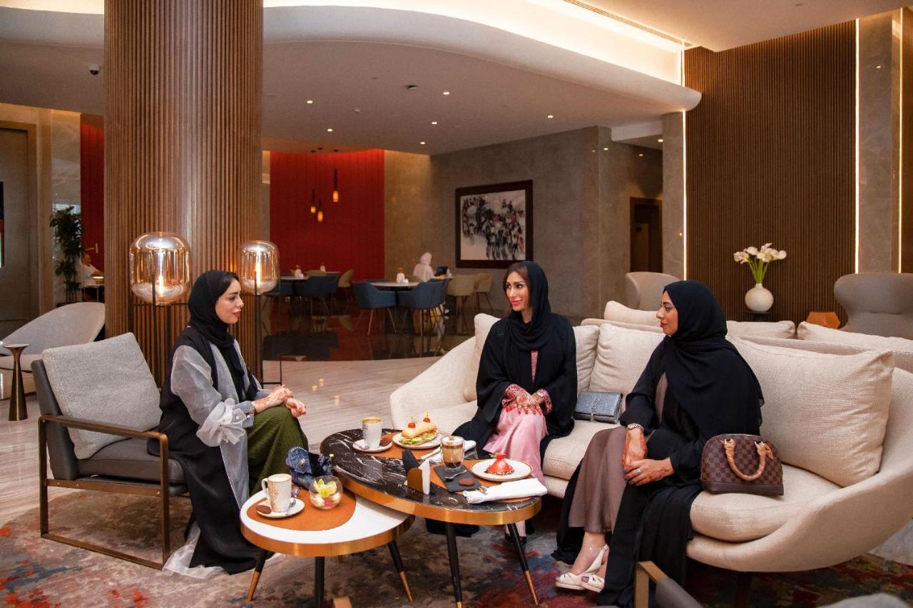 Pullman Sharjah Hotell Exteriör bild Arab women in Dubai wearing the abaya